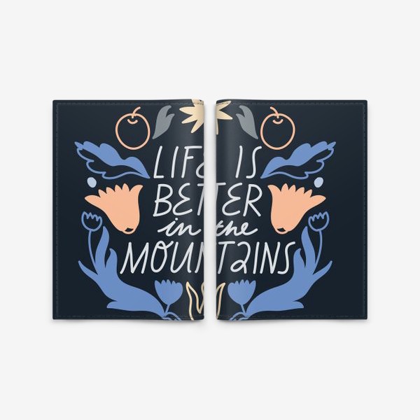Обложка для паспорта «Леттеринг “Life is better in the mountains” с цветочными элементами»